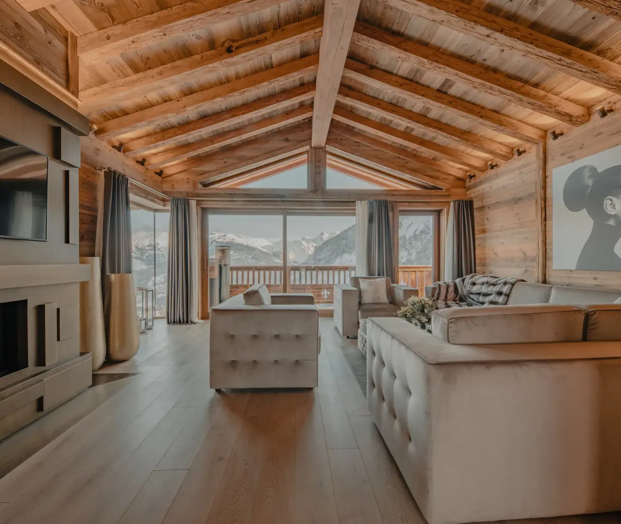 A luxurious chalet living room with alpine views, blending natural wood tones and modern elegance.