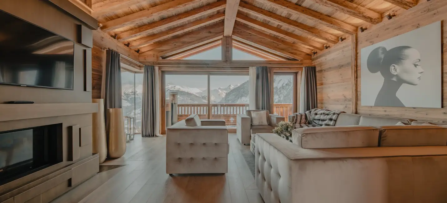 A luxurious chalet living room with alpine views, blending natural wood tones and modern elegance.